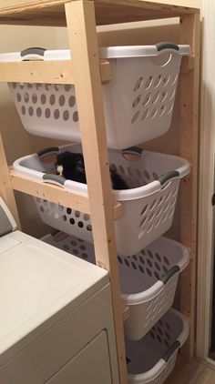 a laundry room with several baskets on the shelves