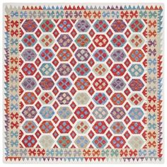 a colorful rug with geometric designs on it