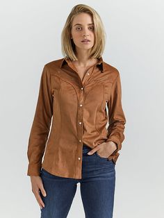 When the occasion calls for something dressier than denim, our Women’s Faux Suede Rodeo Snap Shirt provides the perfect alternative. It comes with classic tailoring and a slim silhouette that flatters from every angle. This long-sleeve collared shirt is crafted from a soft fabric blend that mimics the look of suede but with a hint of stretch for extra comfort. This Western snap shirt shines in the details, including fancy yokes from front to back, faux smiley chest pockets with classic piping, a Children Bottoms, Plus Jumpsuit, Tailored Design, Tan Suede, Plus Dresses, Collared Shirt, Collar Shirts, Classic Looks, Rodeo