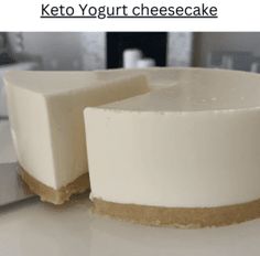 a white cheesecake sitting on top of a counter