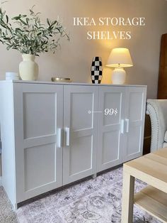 an ikea storage cabinet with doors and drawers in a living room next to a couch