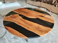 a wooden table with black and white stripes on it