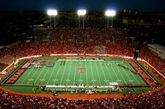 an aerial view of a football stadium at night