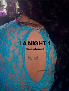 the back of a woman's shoulder with an inscription la night 1 on it