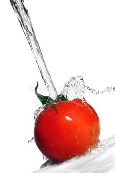 a red tomato is being splashed with water on white background royalty images and clippings