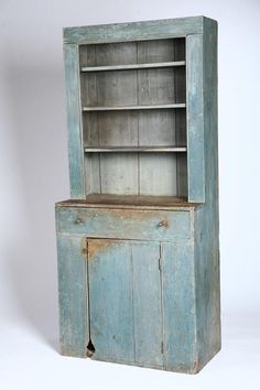 an old wooden cabinet with two doors and one door open on the side, against a white background