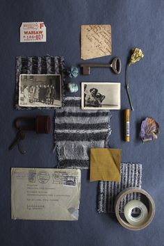 an assortment of items are laid out on a blue tablecloth with writing and pictures