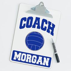 a clipboard with the words coach morgan on it and a pen in front of it