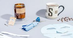 the contents of a mask, scissors and coffee mug