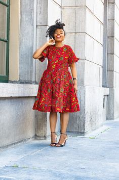 If you love trendy wear, The Mandisa red dress is your go-to choice. You can dress it up or down and add accessories of your choice to this strikingly colourful and beautiful piece.   Unlined 100% cotton, no stretch. Dress length is 42 inches Handmade in Africa. Model is wearing size Small. LOOK AFTER ME Hand wash separately using a mild detergent and cold water. Press on the reverse side with a cool iron. Do not machine wash. Do not bleach. Affordable Red Bohemian Midi Dress, Cheap Red Bohemian Midi Dress, Luxury Red Midi Dress For Garden Party, Cheap Casual Red Midi Dress, Cheap Red Dresses With Vibrant Print, Red Floral Print Knee-length Midi Dress, Red Floral Print Cotton Dress, Red Cotton Knee-length Dress, Red Knee-length Cotton Dress