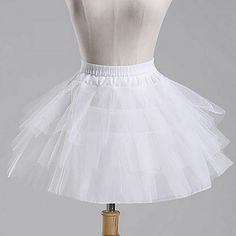 We only accept Paypal payment New Flower Girl Bridesmaid 4 layer White Underskirt Petticoat One Size When sourcing these we chose to stock the better quality versions rather than the low end offerings which have thin netting, poor build quality etc.   Length:18"/46cm Waist: 20", it's elasticated so it can expand. It also has a draw sting to make it smaller. 3 layers of thick netting and 1 layer of white polyester Elastic waist with velcro fastening and drawstring This flattens and folds to a con Crinoline Skirt, Skirt Tutu, White Tulle, Party Dress Short, Ruffle Shorts, Flower Girl Dress, Tutu Skirt, Petticoat, Wedding Accessories