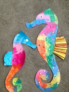 a colorful sea horse made out of paper