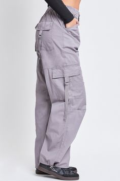 Add style, comfort, and versatility to your pant collection with our women’s elastic waist cargo pants. This relaxed-fit cargo pant is constructed with lightweight cotton fabric for maximum comfort and versatility. Our cargo pants for women have a relaxed leg, baggy fit from hip to hem, and are full-length with a drawstring hem for an option to wear open or tied for a cinched ankle. Detailed with two classic side patch front pockets, and two ring closure front and back pockets these cargo pants Baggy Utility Cargo Pants With Elastic Waistband, Relaxed Fit Full Length Cargo Pants With Multiple Pockets, Full Length Cargo Pants With Pockets, Solid Color Full Length Cargo Pants, Full-length Cotton Cargo Pants, Cotton Cargo Pants With Belt Loops, Full-length Cotton Cargo Pants With Hip Pockets, Relaxed Fit Cargo Pants Utility Style, Relaxed Fit Cargo Pants In Utility Style