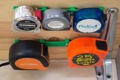 several different types of tape measures on a shelf