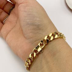 Chunky curb chain bracelet. The Versa bracelet is a classic. Length: Approx. 7" long. Material: 14K gold-plated Classic Tarnish Resistant Cuban Link Bracelet, Luxury Everyday Bracelets With Curb Chain, Luxury Curb Chain Bracelets For Everyday, Luxury Curb Chain Bracelet For Everyday, Luxury Everyday Curb Chain Bracelets, Elegant Cuban Link Bracelet With Solid Construction, Elegant Curb Chain Bangle, Classic Cuban Link Chain Bracelet For Everyday, Everyday Tarnish Resistant Cuban Link Bracelets