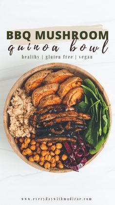 a bowl filled with meat, beans and greens on top of a white tablecloth