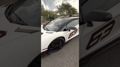 three different shots of a white sports car with red numbers on it's side