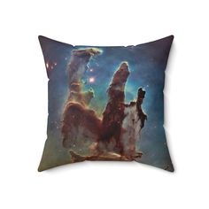 a pillow with an image of two pillars in the sky