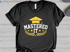 Mastered it shirt master degree graduation gifts idea for men women kids     Unisex Gildan T-shirt * 100% ring-spun cotton * Sport grey is 90% ring-spun cotton, 10% polyester * Dark heather is 65% polyester, 35% cotton * 4.5 oz/y² (153 g/m²) * Pre-shrunk * Shoulder-to-shoulder taping * Quarter-turned to avoid crease down the center     Unisex Bella Canva Shirt * 100% combed and ring-spun cotton (heather colors contain polyester) * Fabric weight: 4.2 oz (142 g/m2) * Pre-shrunk fabric * Shoulder-to-shoulder taping * Side-seamed     Unisex Bella Canva Tank top * 100% combed and ringspun cotton * Tri-blends are 50% polyester/25% combed/25% ringspun cotton/rayon * Side-seamed, unisex sizing * Sizes - XS-2XL     Women Shirt Next Level 3900 100% combed ringspun cotton (fiber content may vary for Pre-shrunk Cotton T-shirt For Graduation Party, Black Pre-shrunk T-shirt For Graduation Gift, Cotton Graduation T-shirt, Cotton T-shirt For Graduation Party, Cotton T-shirt For Graduation, Master Degree Graduation, Masters Degree Graduation, Degree Graduation, Mastered It