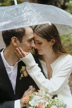 Couple posing underneath a clear umbrella during their California redwood elopement. Get inspired by their intimate elopement photos and choose the California redwoods - one of the best California elopement locations for your special day! Book Julia as your California elopement photographer at juliaminaphotography.com!