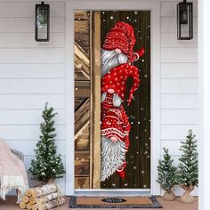 the door is decorated with an image of santa claus and snowflakes on it