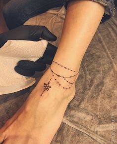 a woman's foot with a star tattoo on her left ankle and the words, creative