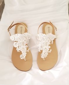 White lace bridal sandals are designed with feminine lace design. They are perfect for your Destination Wedding or a comfortable alternative for traditional brides. The comfortable wedding sandals are vegan friendly. They are perfect for wearing at your reception so you can dance the night away in comfort! After the wedding wear them all summer long. The lace is white and the sandal straps are an off white/neutral color. Additional beach inspired items can be found in my shop http://www.etsy.com White Lace Wedding Shoes With Ankle Strap, White Lace Ankle Strap Wedding Shoes, Summer Wedding Closed Toe Shoes For Ceremony, Summer Wedding Closed-toe Shoes, White Bridal Accessories For Summer Bridal Shower, White Summer Bridal Accessories For Bridal Shower, Summer White Bridal Accessories For Bridal Shower, Summer Bridal Accessories For Bridal Shower, Summer Wedding Ceremony Shoes With Ankle Strap