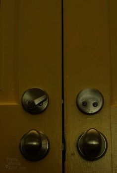 an open door with two knobs on it