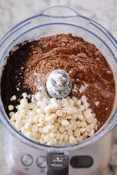 a food processor filled with ingredients for making macaroni and cheese