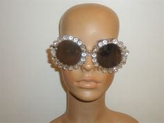 This listing is for a pair of unused really nice Betsy Johnson sunglasses.  These sunglasses are designed with a really cool clear trim and have mirrored lenses.  They have 100% UV Protection. No scratches. Guaranteed to be in excellent unused condition. Perfect for spring/summer.  Make this a great gift or treat yourself!! Party Sunglasses With Anti-reflective Glass, Vintage Silver Sunglasses For Party, Clear Sunglasses With Uv Protection For Parties, Party Sunglasses With Clear Mirrored Lenses, Party Clear Sunglasses With Mirrored Lenses, Party Clear Mirrored Sunglasses, Kew Gardens, Betsy Johnson, Vintage Brown