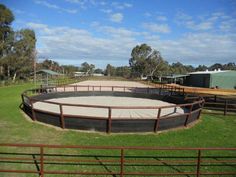 a large circular structure in the middle of a field