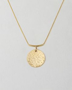 Celebrate your unique journey with our Signature Hammered Coin Necklace, crafted for those who live with intention. The 1'' hammered coin is attached to a distinctive curved bar, creating a look that's both intentional and elegant. Engrave a phrase that inspires and supports you through every step of your growth and healing. This hand-hammered charm is a daily reminder to honor your true self, embracing both your strengths and imperfections. Made with premium 14k gold-filled or .925 sterling sil Everyday Hammered Round Disc Coin Necklace, Everyday Hammered Medallion Jewelry, Everyday Round Disc Coin Necklace With Adjustable Chain, Everyday Coin Necklace With Adjustable Chain, Everyday Minimalist Hammered Coin Necklace, Everyday Hammered Coin Necklace With Round Pendant, Everyday Hammered Round Disc Jewelry, Minimalist Adjustable Coin Pendant Jewelry, Minimalist Hammered Round Coin Necklace