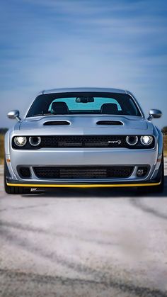 the front end of a silver sports car