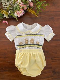 Pre-order handmade smocked romper. It takes 4-6 weeks to ship. Thank you for your patience. Thank you for supporting a small business. Clothing Care Instructions Most items can be washed safely in cold water on delicate cycle and hung to dry. If the item that you are ordering has red or another bright color in it next to a white or other light color fabric please use a Shout color catcher for the first few washes to avoid bleeding. The reds are pre-washed but they are still red and will likely h Spring Bubble Romper With Smock Detail, Spring Fitted Smocked Bubble Romper, Spring Fitted Smock Bubble Romper, Fitted Smock Bubble Romper For Summer, Smocked Back Fitted Bubble Romper For Playtime, Cute White Bubble Romper With Smocked Bodice, Small Business Clothing, Smocked Romper, Business Clothing