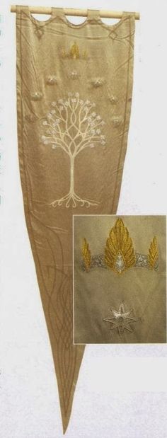 an image of a piece of cloth that has been embroidered with gold leaves and a tree on it