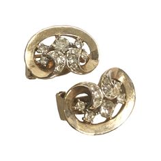 Beautiful gold and diamond cubic zirconia clip on earrings from the 1980's. This beautiful set features 11 diamonds in an ornate setting. Although pre-owned these earrings are in very good pre-worn condition with very small scratches from wear. The clips are in excellent working condition and still fit tight.  They will add lots of sparkle to any outfit. Due to the delicate nature of these vintage items - ALL SALES ARE FINAL. Thank you for understanding. 1980s Party Outfits, Diamond Brooch, Anaheim, Cute Earrings, Vintage Brooches, Clip On, Vintage Gold, Clip On Earrings, Round Diamonds