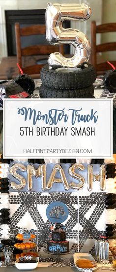 a birthday party with monster trucks and cars on it's table, surrounded by foil balloons