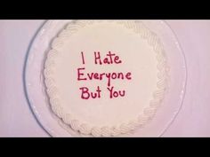 i hate everyone but you written on a cake