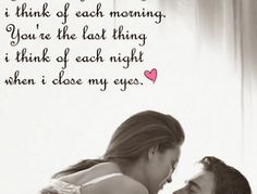 a man and woman laying in bed next to each other with the words you're the first thing i think of each morning