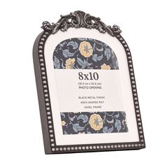 the 8x10 frame is decorated with flowers and pearls on it's edges