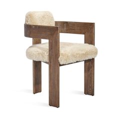 a wooden chair with sheep fur on it