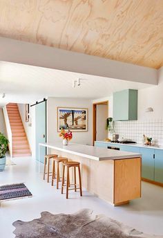 the kitchen is clean and ready to be used as a living room or dining area