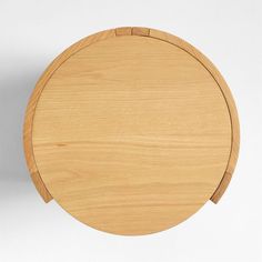 a round wooden table top on a white background