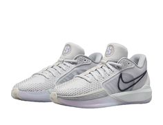 the nike zoom basketball shoe is shown in white and grey with reflective accents on the upper part