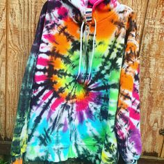 Rainbow Bright & Black Tie Dye Sweatshirt // Unisex Adult Sweatshirt // Crew Neck or Hoodie Tie-Dye makes everyone happy :) Made to Order - There will be slight variations in design, and each one is unique. Dyes & Process used will ensure your shirt stays bright & colorful for years to come. *The front and back will look different, like pictured* Sweatshirts are 90% cotton, 10% poly. Wash & Care: All items are pre-washed so they should not bleed or fade color. I recommend to wash Multicolor Fleece Hoodie Top, Multicolor Fleece Hoodie, Oversized Multicolor Hooded Top, Rainbow Long Sleeve Sweatshirt For Fall, Long Sleeve Rainbow Sweatshirt For Fall, Multicolor Fleece Sweatshirt With Drawstring Hood, Rainbow Long Sleeve Sweatshirt For Winter, Multicolor Crew Neck Sweatshirt With Drawstring Hood, Rainbow Long Sleeve Hoodie For Winter