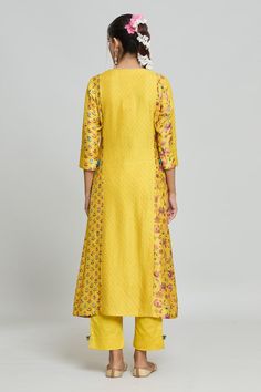 Yellow kurta with pintuck details and floral pattern. Paired with a matching pant. - Aza Fashions Straight Kurta Sets With Printed Motifs For Work, Straight Kurta With Printed Motifs For Work, Workwear Sets With Printed Motifs And Straight Kurta, Traditional Workwear Sets With Printed Motifs, Eid Straight Kurta With Pintucks, Traditional Printed Kurta For Workwear, Traditional Workwear Kurta With Printed Motifs, Festive Cotton Kurta With Pintucks, Eid Pintucks Straight Kurta