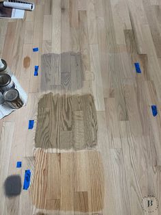 the floor is being laid out with blue tape on it and there are other items in the room