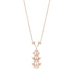 This is an authentic BULGARI 18K Rose Gold Diamond Diva's Dream Pendant Necklace. The necklace is crafted of 18 karat rose gold and features a drop cluster pendant comprised of the signature fan motifs set with round brilliant cut diamonds along with bezel-set diamonds on the chain, approximately 1.73 total carat weight. Bezel Set Diamond, Cluster Pendant, Rose Gold Diamonds, Rose Gold Necklace, Gold Pendant Necklace, Round Brilliant Cut Diamond, Brilliant Cut Diamond, 18k Rose Gold, Round Brilliant