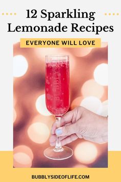 a hand holding a wine glass with the words, 12 sparkling lemonade recipes everyone will love