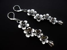 This is a pair of pretty  flower  themed dangly leverback hook earrings. Measure approx. 6cm long. With silver plated hooks and findings. Thanks for looking!! Silver Flower Earrings With Lever Back Ear Wires, Silver Flower Earrings With Lever Back, Pretty Flower, Silver Flowers, Hook Earrings, Pretty Flowers, Jewelry Earrings Dangle, Silver Plated, Dangle Drop Earrings